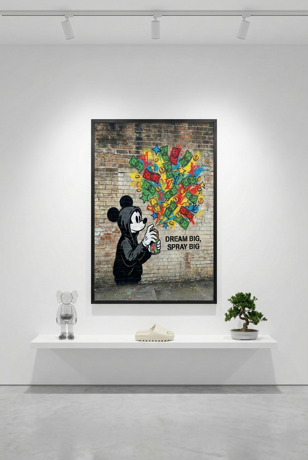 The 'Mickey's Mouse-ka-Tool' framed art piece is the sole focus on a large white wall in a minimalist gallery, with a single floating shelf below it.