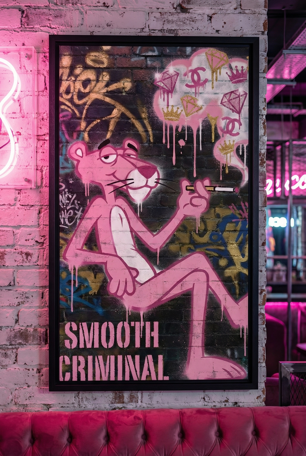 Wooden Framed "Diamond Drip Criminal" pop art by Brzk mounted on a distressed white brick wall next to a pink neon sign in a trendy nightlife lounge or bar setting.