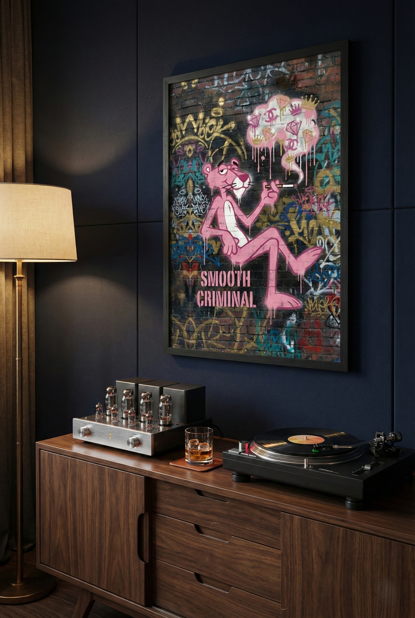 Premium framed "Diamond Drip Criminal" street art hanging above a vintage high-fidelity audio setup with a turntable and tube amplifier in a dark, moody listening room.